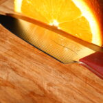 Trillium Paring Knife reflecting Orange